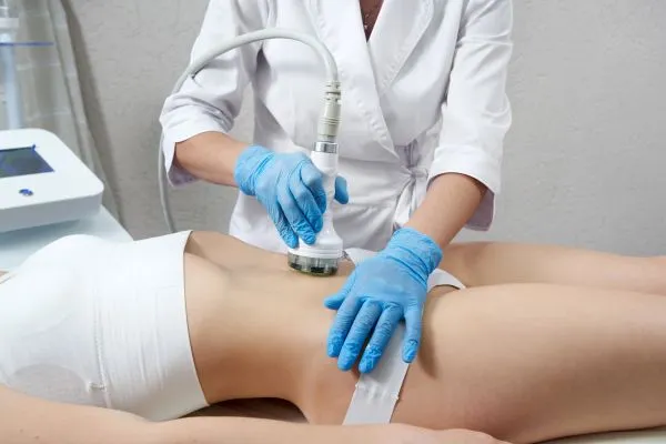 Lost the Weight but Not the Loose Skin? 2 woman having HIFU treatment on her stomach to combat loose skin Olney following weight loss